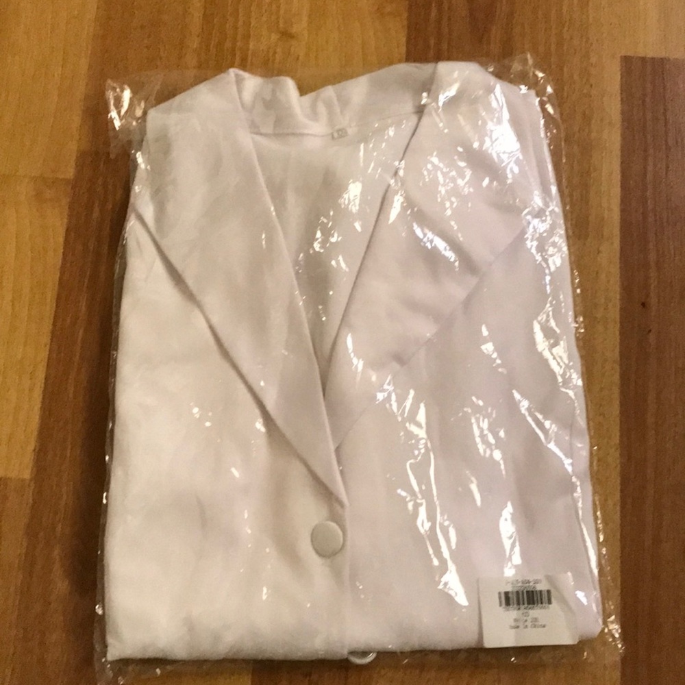White blouse with long sleeves, size XL.